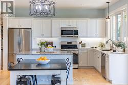 Sprawling kitchen with stainless steel appliances - 
