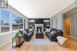 Living room with gas fireplace and built-ins - 