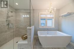 Ensuite bathroom with stand alone soaker tub - 