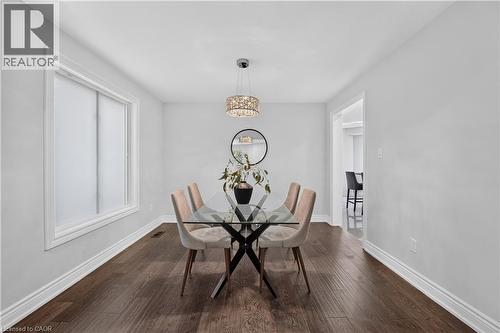 Interior room featuring wood-finish flooring, white baseboards, and light-toned walls - 3346 Chartrand Crescent, Mississauga, ON - Indoor Photo Showing Dining Room