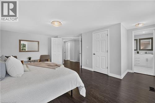 Spacious room featuring dark wood-finish flooring, light grey walls, and white trim - 3346 Chartrand Crescent, Mississauga, ON - Indoor Photo Showing Bedroom