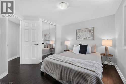 Bedroom featuring dark wood-finish flooring, light grey walls, and a ceiling-mounted flush light fixture - 3346 Chartrand Crescent, Mississauga, ON - Indoor Photo Showing Bedroom