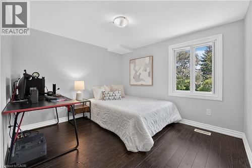 Room featuring dark wood-finish flooring, light grey walls, and white trim - 3346 Chartrand Crescent, Mississauga, ON - Indoor Photo Showing Bedroom