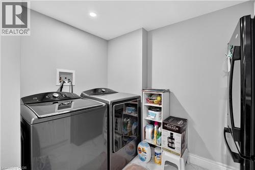 Laundry area featuring a ceiling-mounted recessed light, light gray walls, and a white baseboard trim - 3346 Chartrand Crescent, Mississauga, ON - Indoor Photo Showing Laundry Room