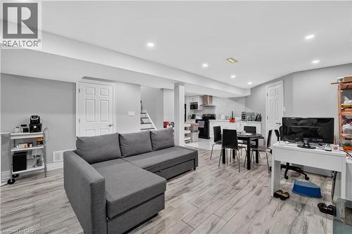 Open-concept living area featuring wood-finish flooring and recessed lighting - 3346 Chartrand Crescent, Mississauga, ON - Indoor Photo Showing Living Room