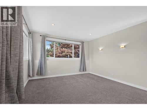 **Virtually Staged** suite bedroom 2 - 2220 Thacker Drive, West Kelowna, BC - Indoor Photo Showing Bedroom