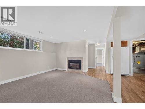 suite living - 2220 Thacker Drive, West Kelowna, BC - Indoor With Fireplace