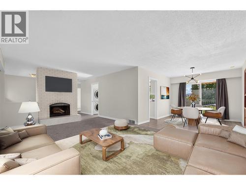 **Virtually Staged** - 2220 Thacker Drive, West Kelowna, BC - Indoor Photo Showing Living Room With Fireplace