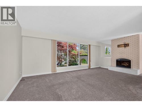 **Virtually Staged** primary bedroom - 2220 Thacker Drive, West Kelowna, BC - Indoor Photo Showing Bedroom