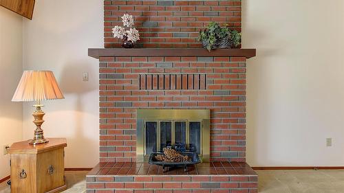 2434 Rhondda Crescent, Kelowna, BC - Indoor Photo Showing Other Room With Fireplace