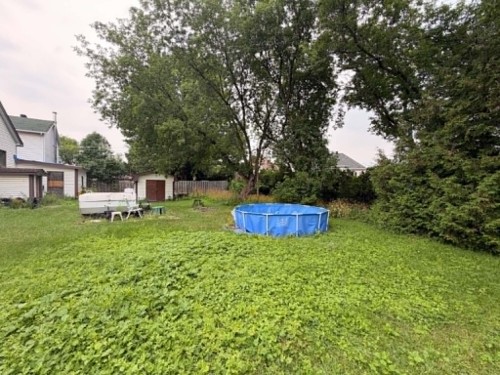 Cour - 45 Rue Onulphe-Peltier, L'Épiphanie, QC - Outdoor With Above Ground Pool With Backyard