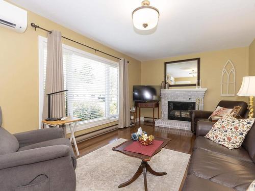 12 Central Avenue, Amherst, NS - Indoor Photo Showing Living Room With Fireplace