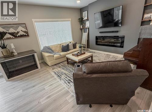 3755 Gee Crescent, Regina, SK - Indoor Photo Showing Living Room With Fireplace