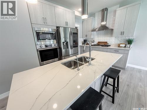 3755 Gee Crescent, Regina, SK - Indoor Photo Showing Kitchen With Stainless Steel Kitchen With Double Sink With Upgraded Kitchen