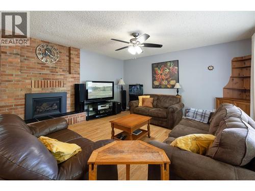 3467 Lockhart Crescent, Armstrong, BC - Indoor Photo Showing Living Room With Fireplace