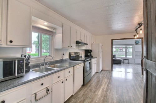 Overall view - 2 Rue Du Parc-Benny, Val-D'Or, QC - Indoor Photo Showing Kitchen With Double Sink