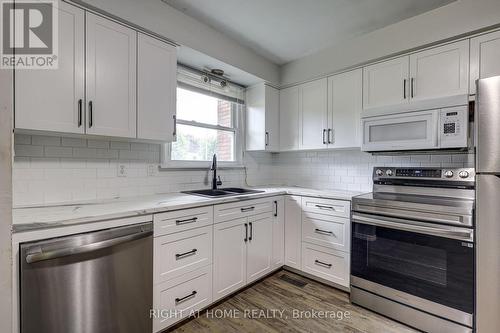 Updated and Appliances Included - 5 - 81 Parkside Drive, St. Thomas, ON - Indoor Photo Showing Kitchen With Double Sink