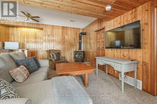 Lower level family room - 10 3Rd Concession Road, Carling, ON - Indoor With Fireplace
