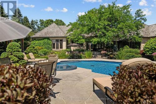 Inground Saltwater Pool with an Integrated Hot Tub - 10090 Pineview Trail, Milton, ON - Outdoor With In Ground Pool With Backyard