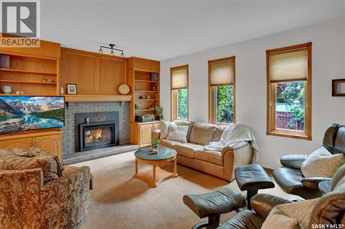 3474 Olive Grove, Regina, SK - Indoor Photo Showing Living Room With Fireplace
