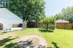 Back Exterior - Deep back lot with out buildings - 