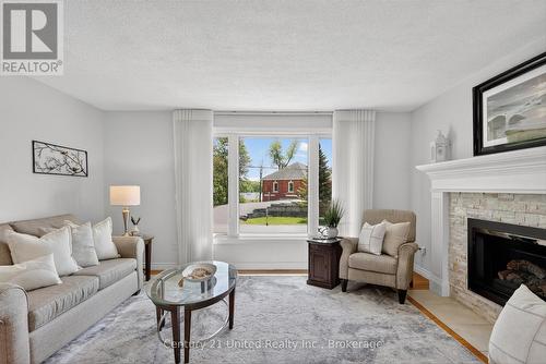 1190 Nuforest Drive, Selwyn, ON - Indoor Photo Showing Living Room With Fireplace