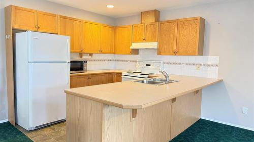 18A Wolf Crescent, Windermere, BC - Indoor Photo Showing Kitchen With Double Sink