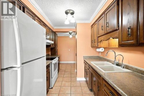 400 Champlain Boulevard Unit# 406, Cambridge, ON - Indoor Photo Showing Kitchen With Double Sink