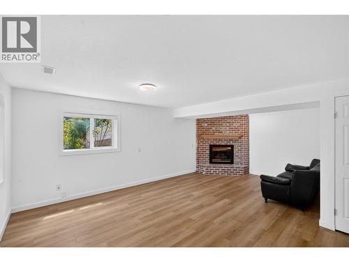 Downstairs Rec Room - 2655 Applegreen Court, West Kelowna, BC - Indoor Photo Showing Living Room With Fireplace