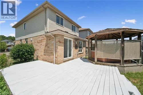 Expansive outdoor deck area featuring a wood-plank surface and an integrated gazebo - 71 Peach Blossom Crescent, Kitchener, ON - Outdoor With Exterior