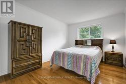 Primary bedroom overlooking the backyard. - 