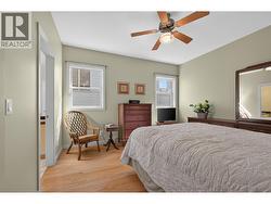 Primary bedroom on the main level with a walk-in closet - 