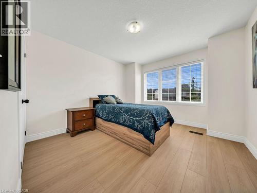 Bright room featuring light wood-finish flooring and white baseboards - 39 Baintree Way, Cambridge, ON - Indoor Photo Showing Bedroom