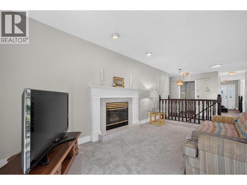 Family room - 602 Glenmeadows Road, Kelowna, BC - Indoor Photo Showing Living Room With Fireplace
