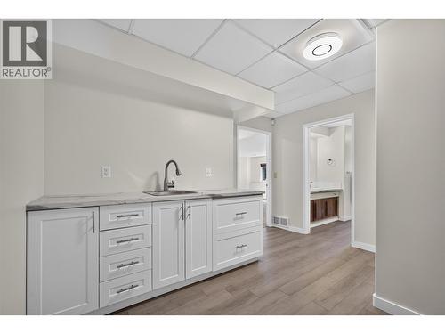Kitchen sink/cabinets near recreation room - 602 Glenmeadows Road, Kelowna, BC - Indoor