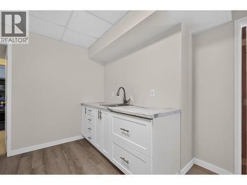 Kitchen sink/cabinets near recreation room - 602 Glenmeadows Road, Kelowna, BC - Indoor