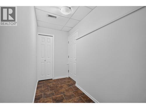 In-law suite entrance on the lower level - 602 Glenmeadows Road, Kelowna, BC - Indoor Photo Showing Other Room