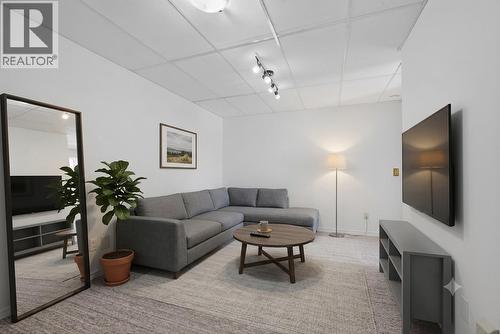 In-law suite living room *virtually staged* - 602 Glenmeadows Road, Kelowna, BC - Indoor