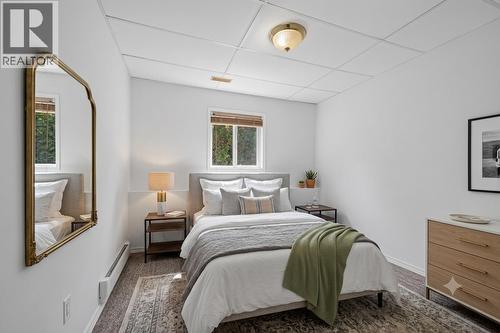 In-law suite bedroom *virtually staged* - 602 Glenmeadows Road, Kelowna, BC - Indoor Photo Showing Bedroom