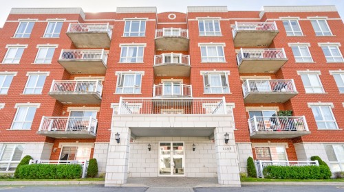 Front of Structure - 306-4405 Boul. St-Jean, Dollard-Des-Ormeaux, QC - Outdoor With Facade