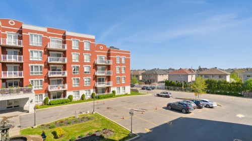 Front of Structure - 306-4405 Boul. St-Jean, Dollard-Des-Ormeaux, QC - Outdoor With Facade