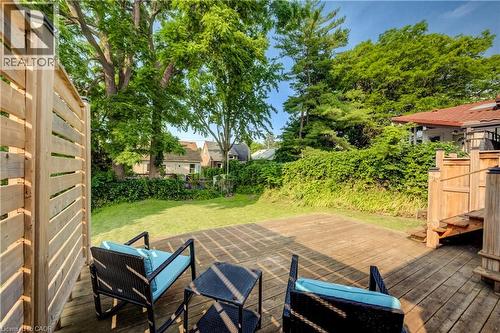 Spacious rear deck crafted from natural wood, featuring slatted privacy screens - 55 Rex Drive, Kitchener, ON - Outdoor With Deck Patio Veranda