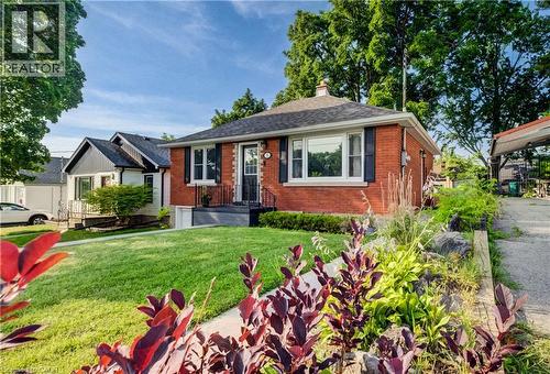 Brick exterior with white trim and black shutters - 55 Rex Drive, Kitchener, ON - Outdoor