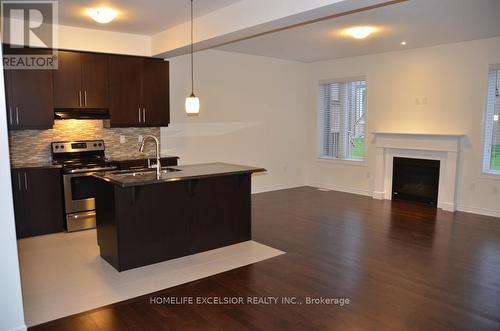 130 Major Crescent, Aurora, ON - Indoor Photo Showing Kitchen With Fireplace