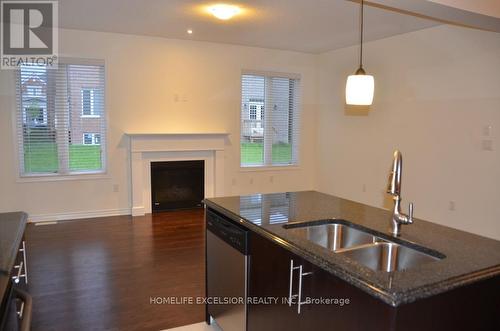 130 Major Crescent, Aurora, ON - Indoor Photo Showing Kitchen With Fireplace With Double Sink