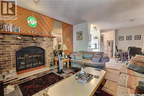 122 Edenwold Crescent, Regina, SK - Indoor Photo Showing Living Room With Fireplace