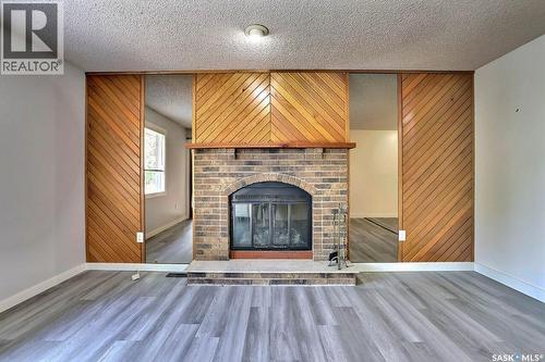 122 Edenwold Crescent, Regina, SK - Indoor Photo Showing Living Room With Fireplace