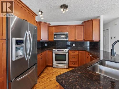 4 Ruby Lane, Whitehorse, YT - Indoor Photo Showing Kitchen With Stainless Steel Kitchen With Double Sink