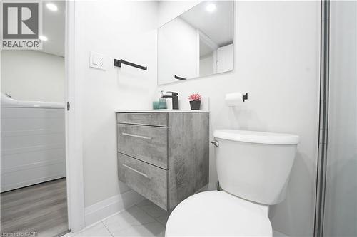 Bathroom featuring a floating vanity with a light gray countertop and a black single-handle faucet - 136 Jansen Avenue, Kitchener, ON - Indoor Photo Showing Bathroom