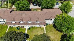 Townhome complex featuring multiple units with individual front yards - 